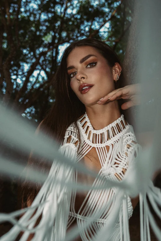 Portrait in a white macrame dress under forest canopy — Faces series by CRZYPNDA